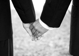 grooms holding hands